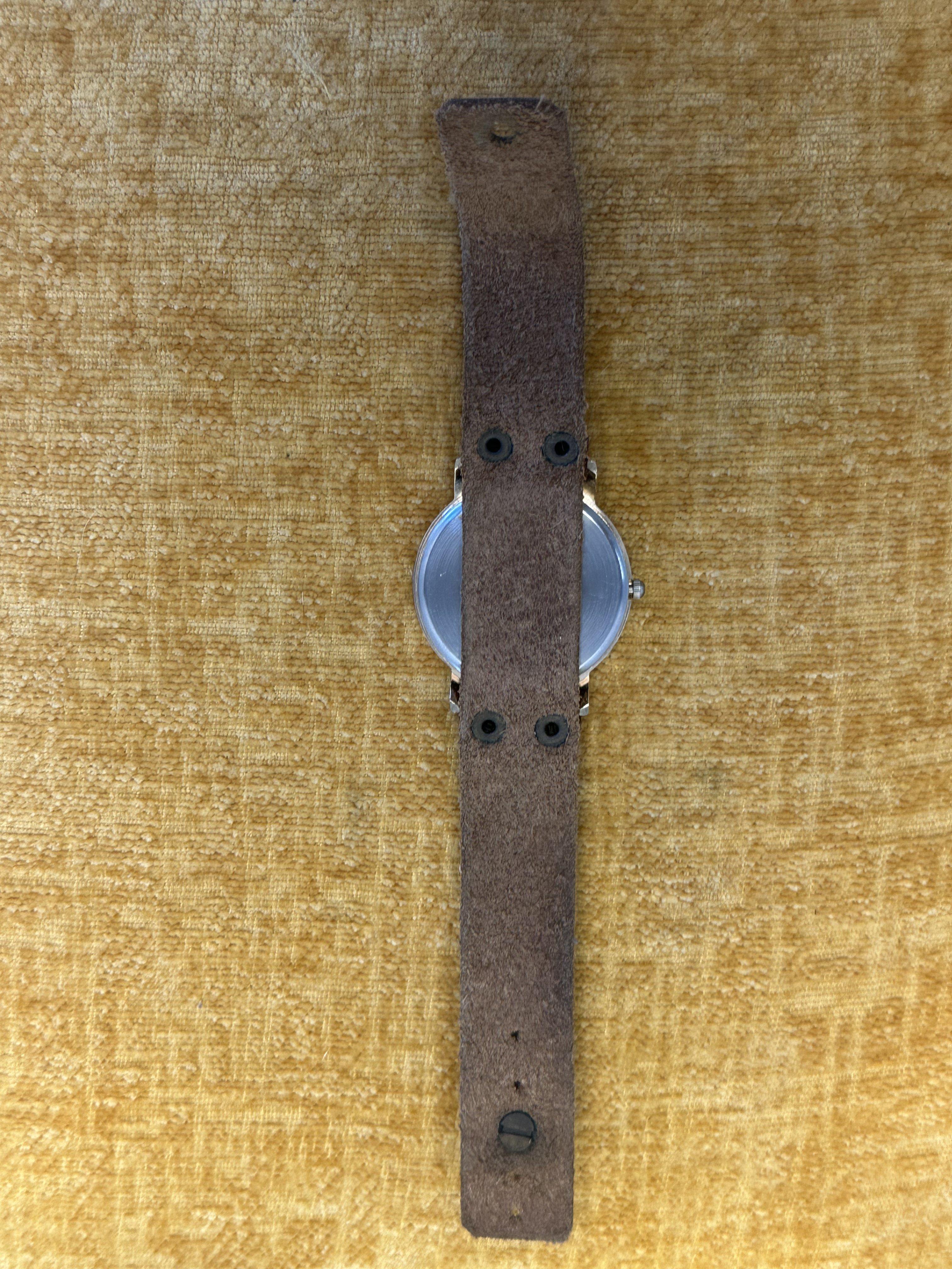 Unbranded World Map Dial Cuff Watch - angle 2